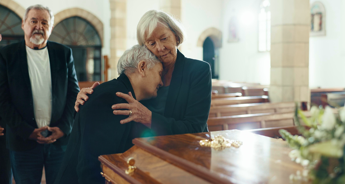 a woman offering comfort with a supportive hug