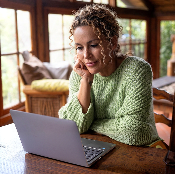 woman staring at her laptop