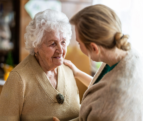 a woman offering comfort to an elderly woman