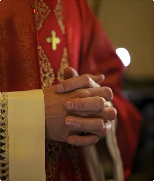 folded hands of a pastor