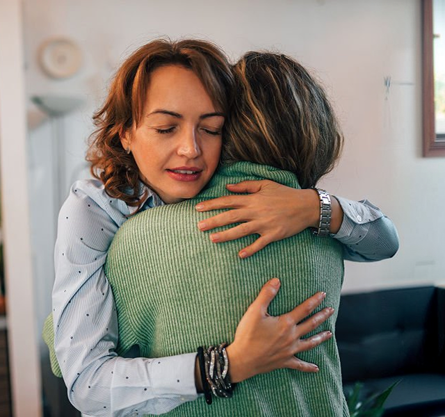 women hugging each other